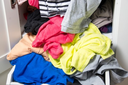 Crew loading green waste into a vehicle for recycling in Hampstead